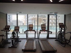 A gym with treadmills, stationary bikes, and a rowing machine. - Arjan Studio with Pool View, Jogging Track & BBQ (Arjan)