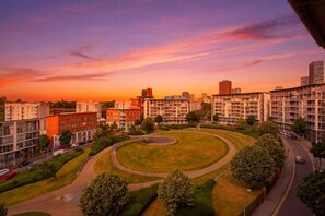 A residential area with apartment buildings, a central circular park, and a road. - #191 Mason Way Executive Stay - Sleeps 6 (West Midlands)