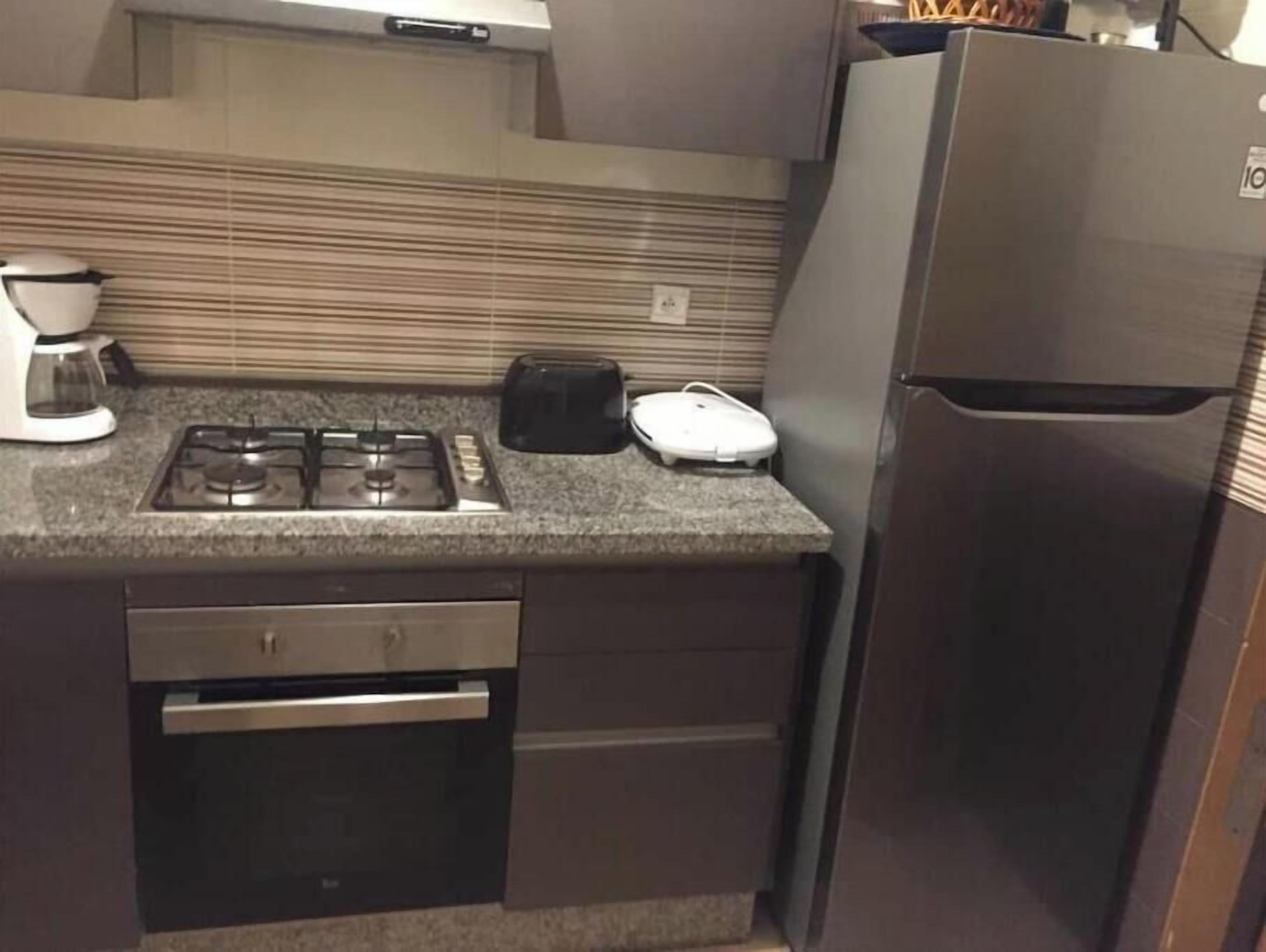 Coffee/tea maker, fridge, microwave, oven