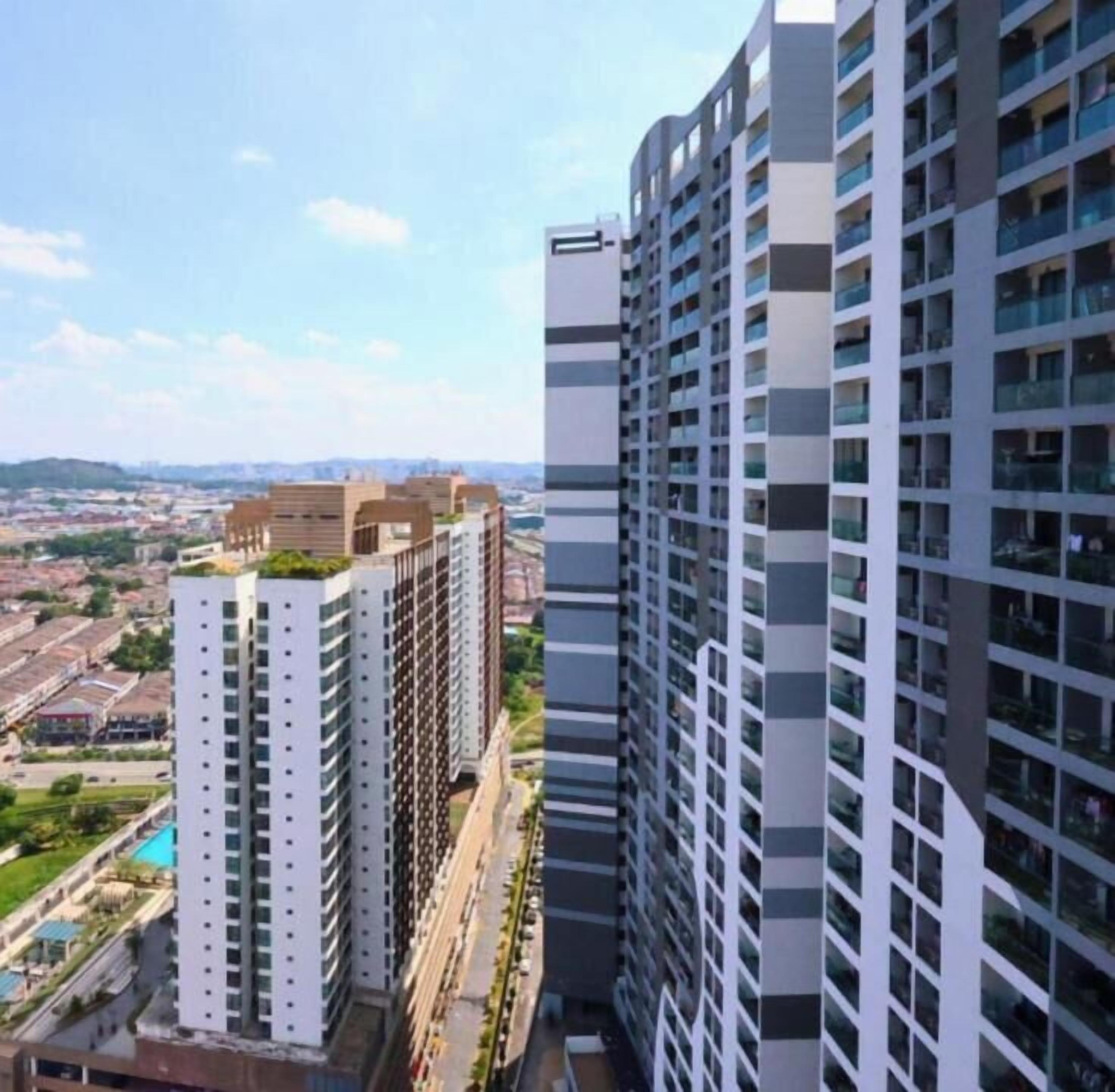 A high-rise building with multiple floors, large windows, and a modern architectural design.