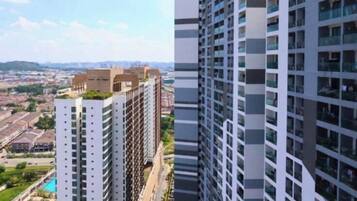 A high-rise building with multiple floors, large windows, and a modern architectural design.