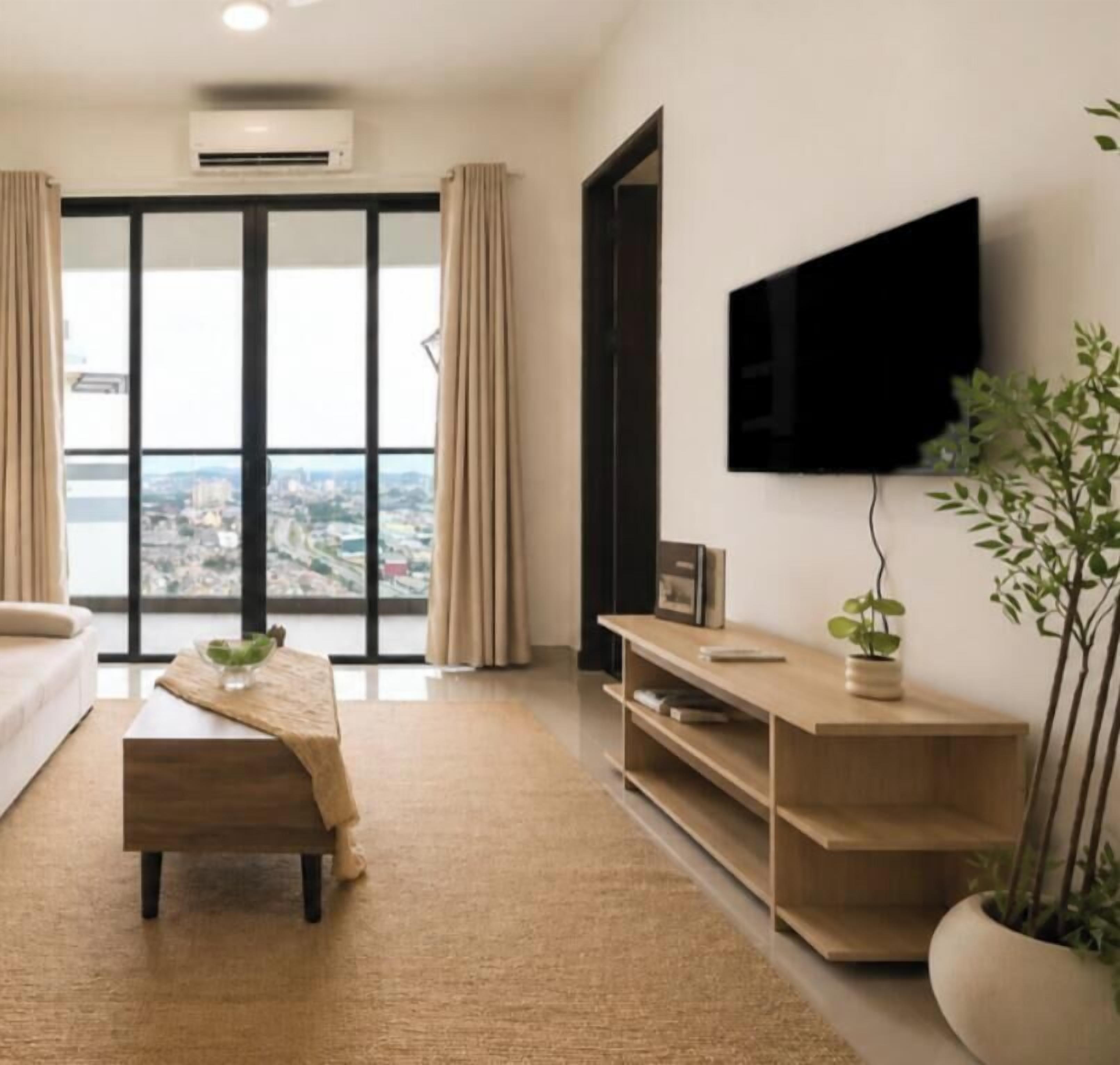 A modern living room with a large window, a flat-screen TV, a sofa, a coffee table, and a potted plant.