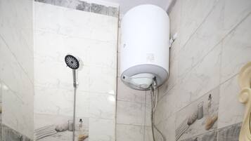 Separate bathtub and shower, towels, soap, shampoo