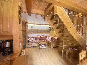 A wooden interior with a bed, a staircase, and a coffee maker. - Apartment at the foot of the slopes - 8 guests (Valmorel)