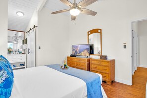 Spacious bedroom with smart TV, ceiling fan, and ensuite bath access, your private retreat within the condo. NAP-C37 - Napili Point 3 Waterfront Villas, Sleeps 16 Complimentary Car with 6 Nights ML-4074 by KBM (Lahaina)