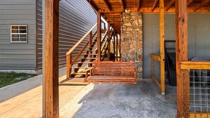 A wooden staircase leading to a stone wall, a concrete porch, and a metal gate. - *NEW* River Valley Retreat ~ directly on White River (Mountain View)