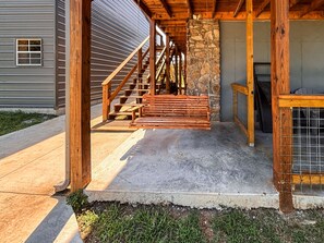 A wooden staircase leading to a stone wall, a concrete porch, and a metal gate. - *NEW* River Valley Retreat ~ directly on White River (Mountain View)