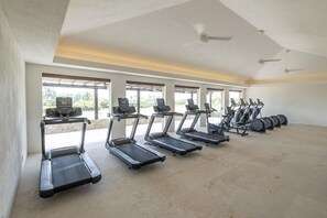A gym with treadmills and stationary bikes arranged in rows. - 3 bed 3 5 bath  Private Pool Wide Ocean Views (Corral del Risco)