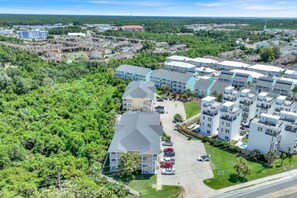 A residential area with multiple apartment buildings, surrounded by dense greenery. - Seventh Heaven in Panama City (Panama City Beach)