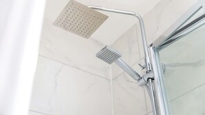 A shower with a square showerhead and a handheld shower attachment. - Stylish 1-bed Stay in the Heart of Barnard Castle (Barnard Castle)
