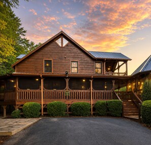 A wooden cabin with a balcony, a covered porch, and a staircase leading to the upper level. - "Starlake" A huge waterfront 5 bedroom estate only 15min to downtown Blueridge. (Mineral Bluff)