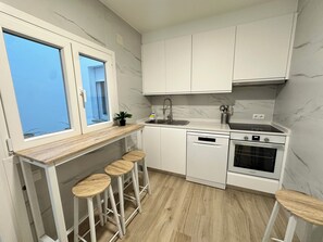 Appartamento Comfort, patio, vista città | Cucina privata