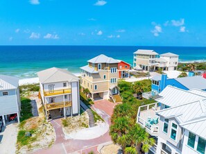 A coastal residential area with houses, a beach, and the ocean. - Singing Waves (Port St. Joe)