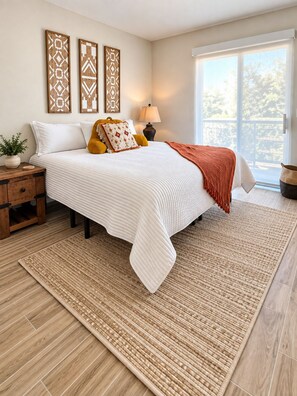 A bedroom with a bed, bedside tables, a lamp, and a view through a window. - Modern Villa+ Scottsdale Resort + Pool + Golf Course+ Walking paths +Gym +Dining (Scottsdale)