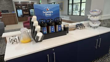 A coffee station with Seattle's Best branded coffee makers and a variety of coffee pods.