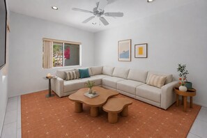 A modern living room with a sectional sofa, a coffee table, a side table, and a ceiling fan. - Villa Toscana - 3BR +Den w/ Pool, Spa & Valley Views (Palm Springs)