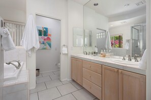 A modern bathroom with a large mirror, two sinks, and a shower. - The Lookout Palm Springs | Stunning Views (Palm Springs)