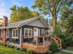 A residential house with a deck, a chimney, and a front door. - Crystal Beach Long Term Coastal Cottage (Fort Erie)