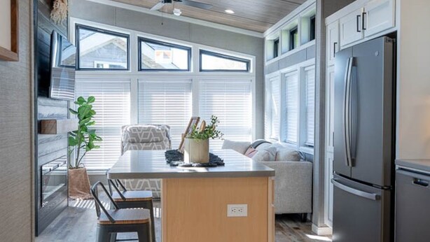 A modern kitchen with a central island, built-in appliances, and large windows. - Frieden Saugatuck (Saugatuck)