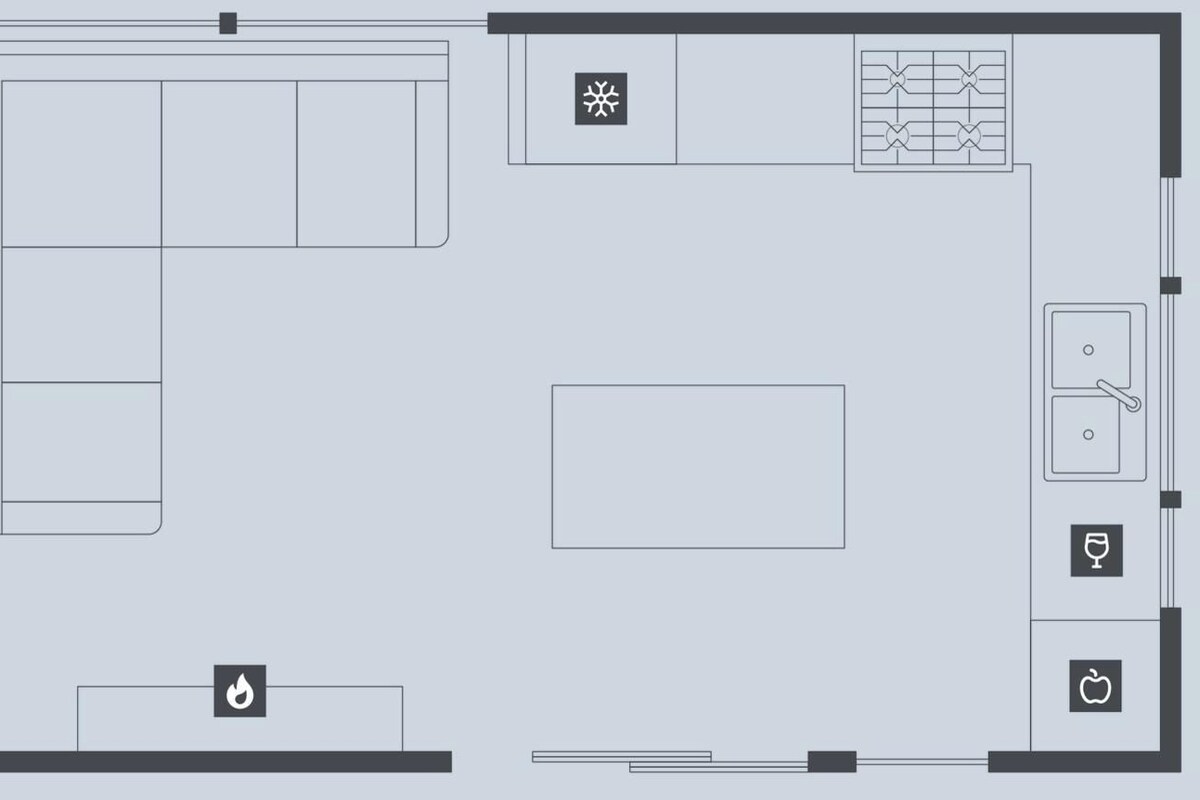 A hotel floor plan with a kitchen, dining area, and a bathroom.