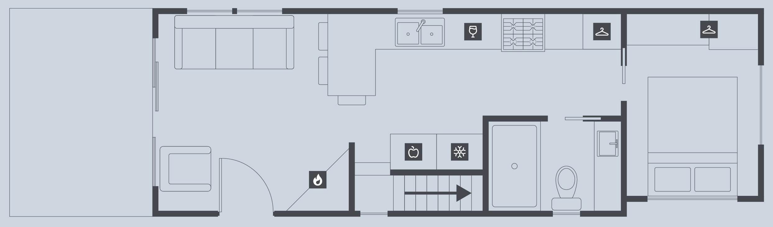 A hotel floor plan with a kitchen, dining area, and a separate bathroom.