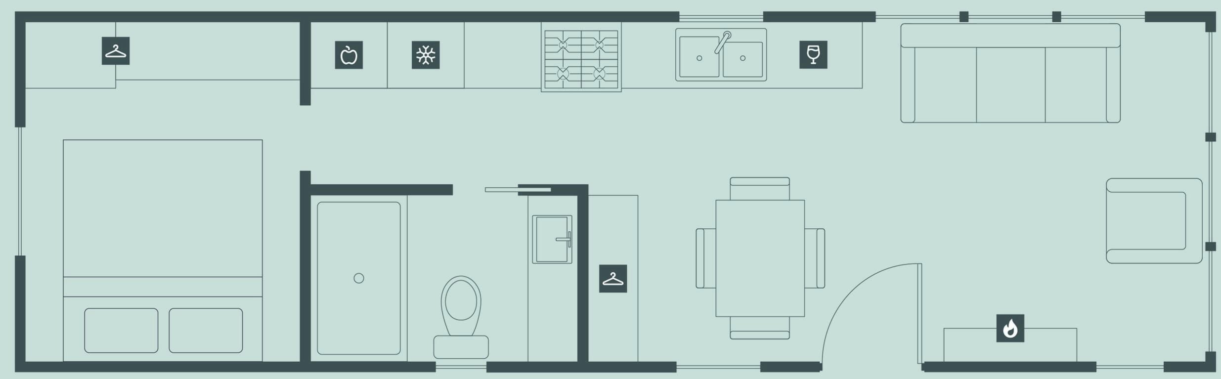 A hotel floor plan with a large dining area, a kitchen, a bathroom, and a small sitting area.