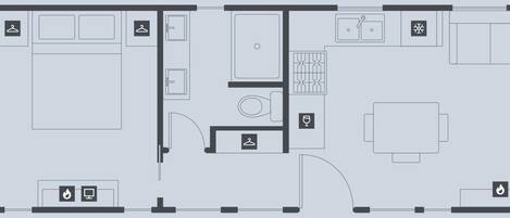 A hotel floor plan with a large central living area, a dining room, a kitchen, and a bathroom.