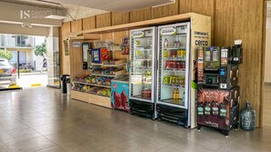 A self-service kiosk area with refrigerated beverage dispensers, snack vending machines, and a clean, tiled floor. - Comfortable Apartment 2Bed/2Bath - Bello Horizonte - Santa Marta (Santa Marta)