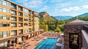 A hotel with a pool, outdoor seating, and mountain views. - Riverfront Perch by Avantstay Balcony + Resort Pool River + Mtn Views (Avon)