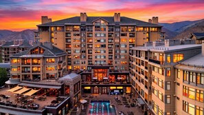 A multi-story hotel with a pool and outdoor seating areas. - Riverfront Perch by Avantstay Balcony + Resort Pool River + Mtn Views (Avon)