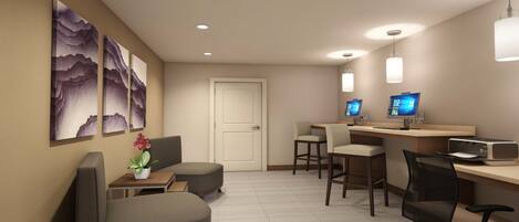 Ein modernes Hotelzimmer mit Schreibtisch, zwei Stühlen, einer Sitzecke und Bildern an den Wänden.