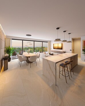 Een moderne keuken met een groot eiland, barstoelen en een eethoek met stoelen en een tafel.
