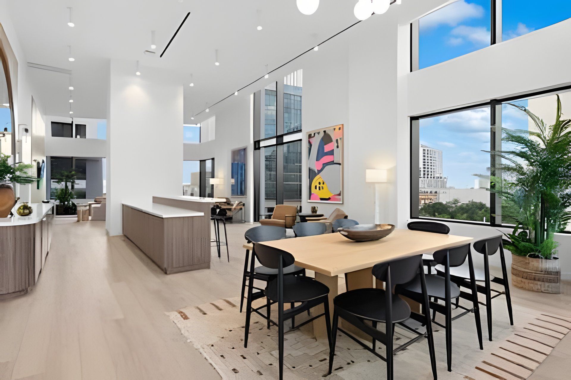 A modern interior with a dining area, kitchen, and living space.