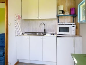 Fridge, microwave, cookware/dishes/utensils - Lötstugan by Interhome (Färjestaden)