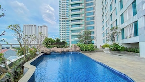 Outdoor pool - Comfortable 1Br Without Living Room At Grand Kamala Lagoon Apartment (Bekasi)
