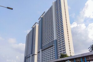 A high-rise building with a grid of windows and a flat facade.