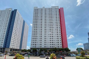 Two high-rise buildings with a clear sky. - Best Studio Apartment Green Pramuka City (Jakarta)