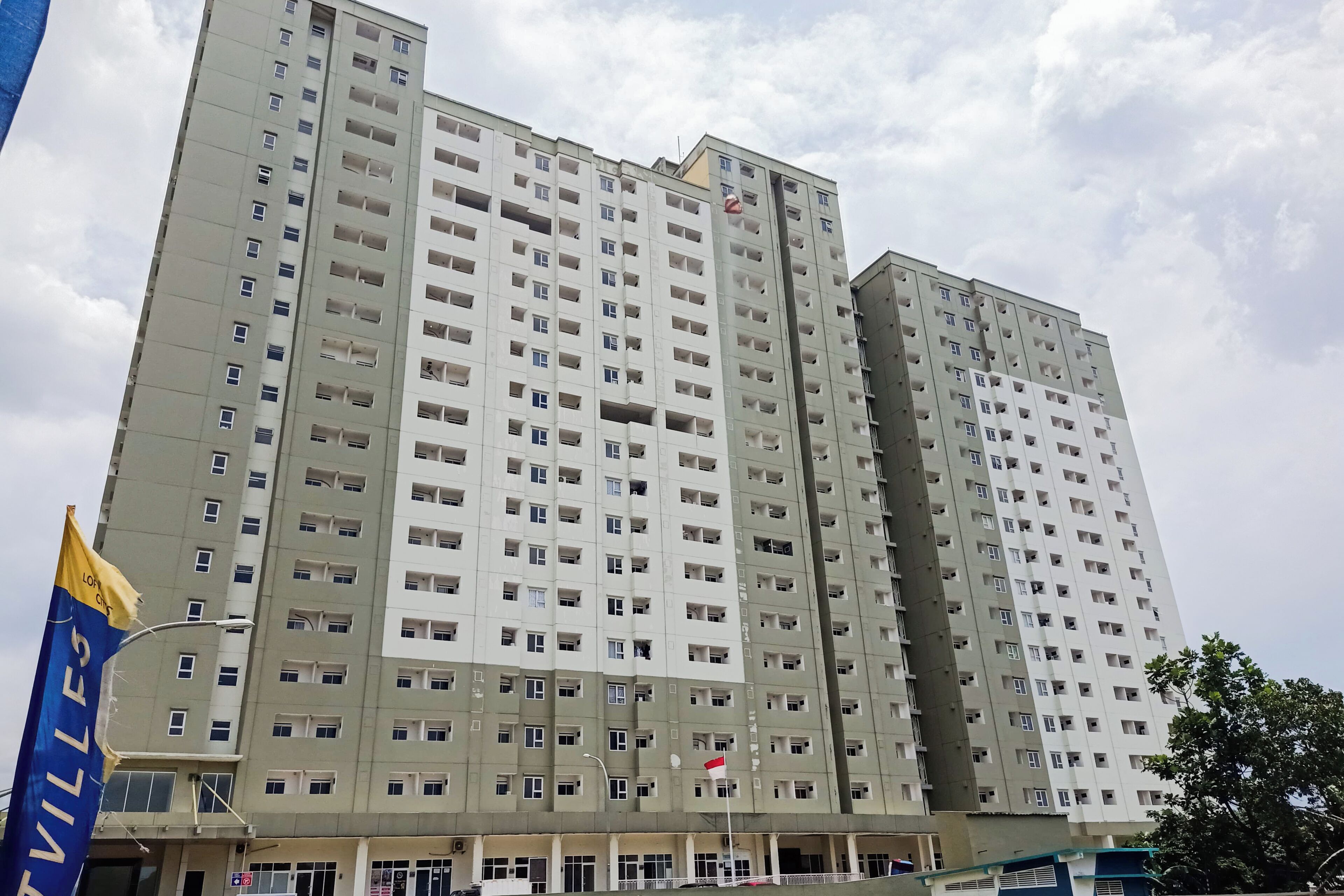 A multi-story residential building with numerous windows and balconies.