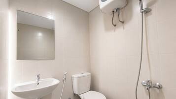 A bathroom with a sink, toilet, and shower.