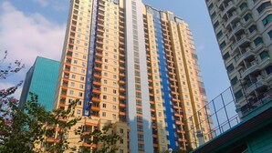A high-rise building with multiple balconies and a modern architectural design. - Elegant & Cozy Living 2Br Boutique Kemayoran Apartment Next To Citra Xperience Mall (Jakarta)