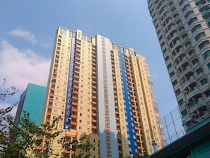A high-rise building with multiple balconies and a modern architectural design. - Elegant & Cozy Living 2Br Boutique Kemayoran Apartment Next To Citra Xperience Mall (Jakarta)
