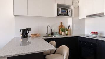 Apartment, 2 Bedrooms | Private kitchen | Fridge, microwave, oven, cookware/dishes/utensils