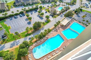A resort with two swimming pools, a parking lot, and a view of the surrounding area. - Gulf Views~Seascape Resort~Large Condo~ARD1701 (Miramar Beach)