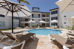 Outdoor pool, a heated pool - 2BR Condo - Walk to Beach & Golf (Puerto Plata)