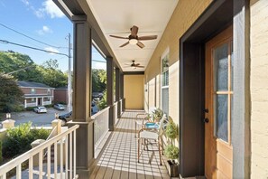 A covered porch with a ceiling fan, a tiled floor, and a view of the street. - Todd's Place in Downtown (638 Madison St, #5) (Clarksville)