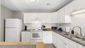 Coffee/tea maker, fridge, microwave, oven