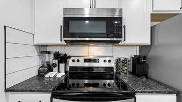 Coffee/tea maker, fridge, microwave, oven