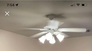 A bedroom with a bed, a nightstand, a lamp, a ceiling fan, and a wall with a decorative phrase. - 3-bedroom flat in Cypress ,second floor with independent entrance  (Cypress)