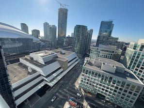 A modern urban skyline with high-rise buildings, including a distinctive curved structure and a building with a large glass facade. - Central Suites Downtown Toronto (Toronto)