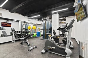 A gym with treadmills, dumbbells, and exercise balls. - Blueground | Bloomingdale, gym, nr Riverside Park (New York)